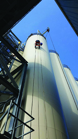 Technician performing proactive silo maintenance