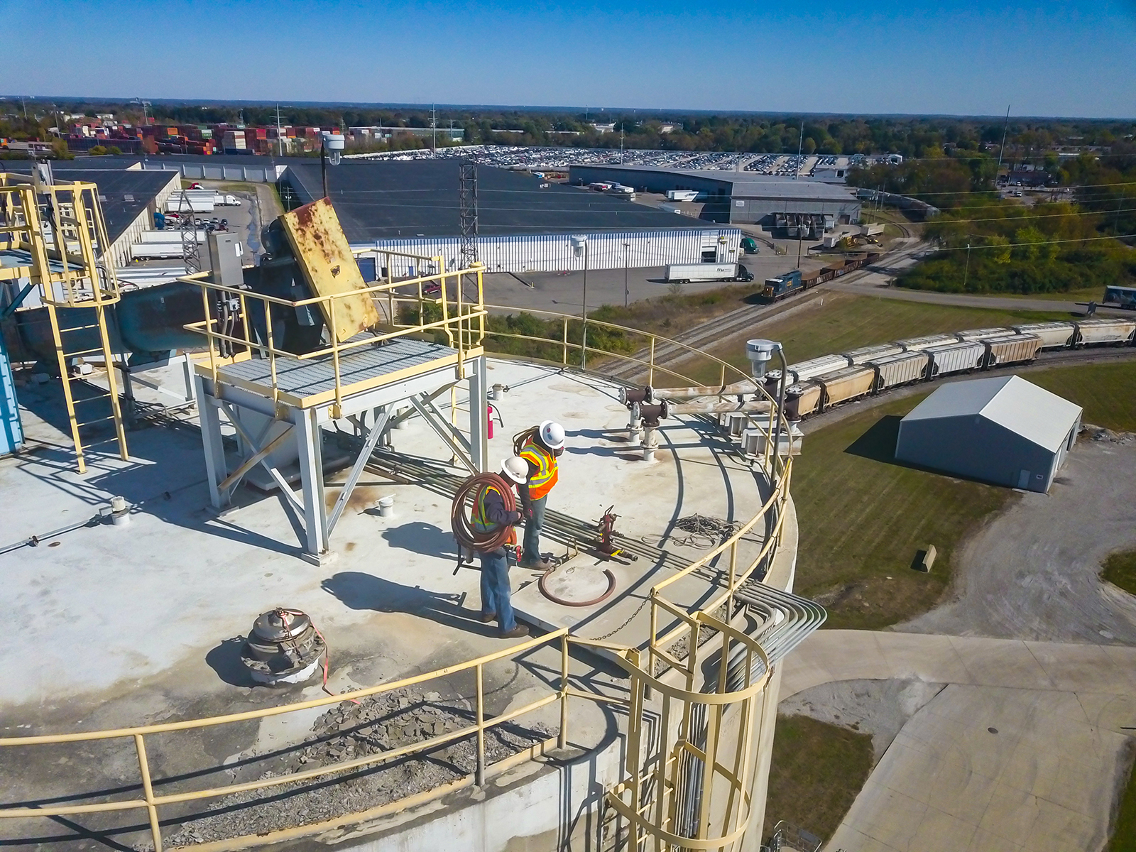 Technician performing cement silo maintenance